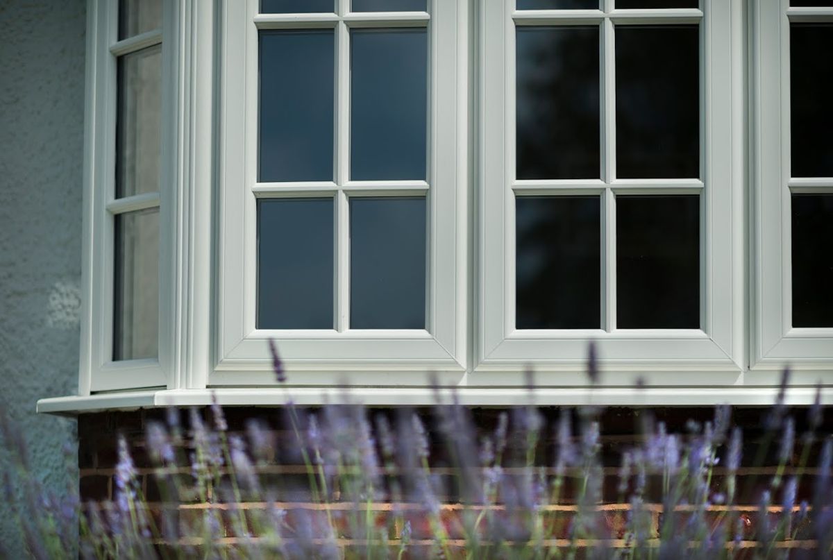 PVCu bay window with duplex georgian bar, photographed with lavender in front of it.