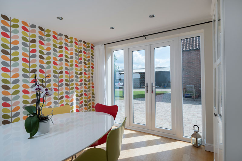 kitchen dining space with upvc french door